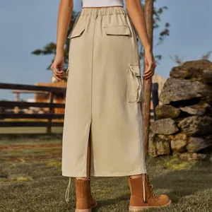 Back view of khaki cargo denim midi skirt with flap pockets and drawstring hem