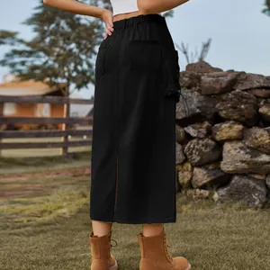 Detailed back view of a retro black denim cargo midi skirt featuring a functional back slit