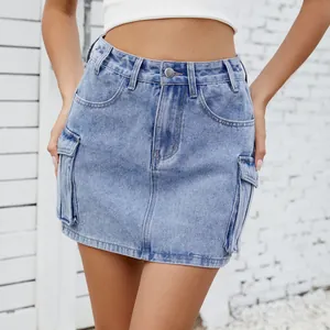 Detailed view of light blue washed denim cargo mini skirt with large side pockets