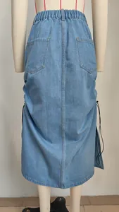 Back view of a light blue denim midi skirt with elastic waist and side drawstrings.