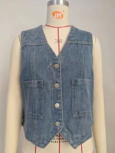 Detailed close-up view of a washed blue denim vest with silver buttons on a mannequin torso