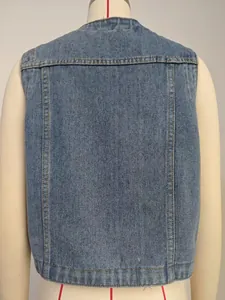 Back detail of women's washed blue denim vest in a slim fit sleeveless design.