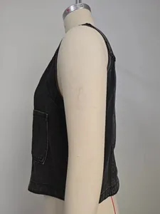 Side profile detail of a slim-fit black washed denim sleeveless vest on a dress form