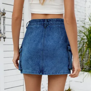 Detail back view of a women's washed blue denim cargo mini skirt with side pockets