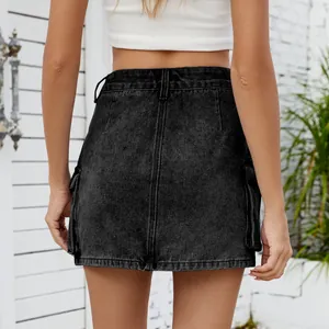 Back view of a washed black retro denim cargo mini skirt with functional pocket details