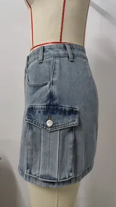 Close-up detail of a functional cargo pocket on a vintage washed denim cargo mini skirt