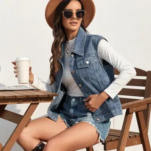 Stylish women's washed blue denim vest featured in a casual outdoor cafe setting.