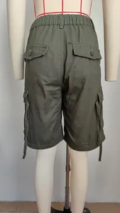 Back view of olive green cargo shorts with elastic waist and buttoned cargo pockets