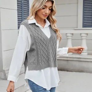 Casual gray V-neck cable knit sweater vest layered over a white shirt for women
