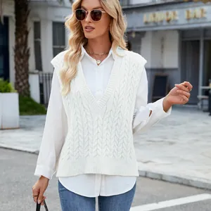 Close-up view of a women's vintage cable knit V-neck sleeveless sweater vest in white