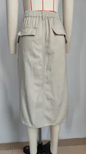 Back view of a khaki cargo denim midi skirt with flap pockets and high waist.