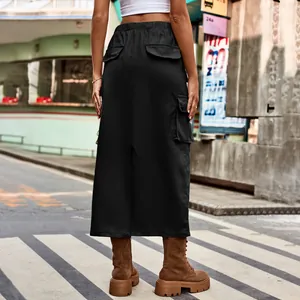 Detailed back view of a black cargo maxi skirt featuring functional flap pockets and slit