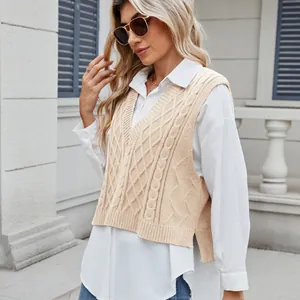 Close-up of a trendy women's V-neck cable knit vest layered over a crisp white button-down shirt