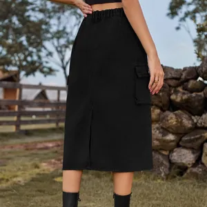 Detail view of stylish black cargo denim midi skirt with back slit and elastic waist.