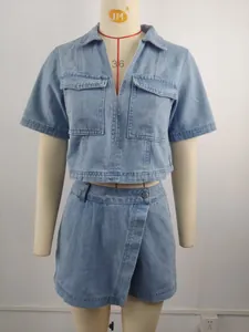 Detailed front view of a women's washed blue denim two-piece set shown on a mannequin