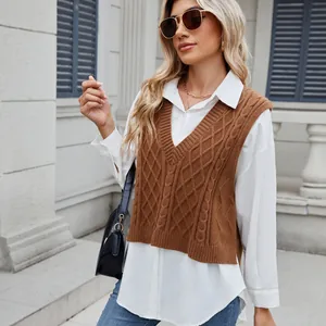 Stylish women's brown cable knit V-neck sweater vest worn by a blonde model outdoors