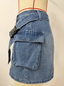 Detail view of washed denim utility skirt featuring large side pocket and buckle belt.
