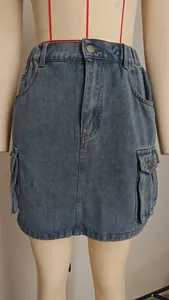 Detail of washed denim cargo skirt with multi-pockets on a professional mannequin