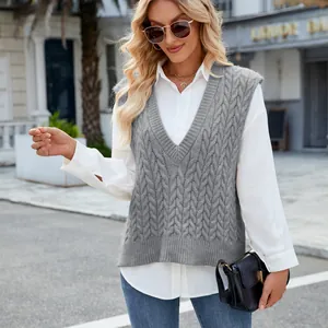 Close-up of a women's V-neck cable knit sweater vest in gray with classic texture.