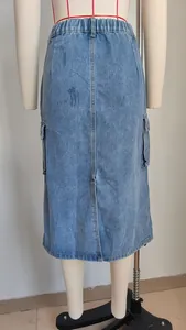 Rear view of washed blue denim cargo midi skirt with elastic waist on mannequin