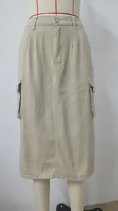 Front view of a khaki cargo denim midi skirt on a mannequin showing pocket details