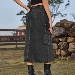 Back view of black denim cargo midi skirt with side pockets and elastic waist