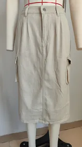 Close-up front view of a beige cargo denim midi skirt displayed on a mannequin.