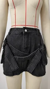 Close-up detail of high waist washed charcoal denim skirt with buckle and cargo pockets