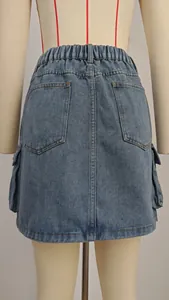 Back view of washed denim cargo mini skirt featuring elastic waist and pockets