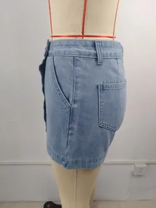 Detailed side view of high-waisted light blue denim skort with pocket and wash finish