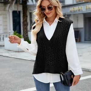 Close-up detail of a stylish black V-neck cable knit sweater vest for women's wear