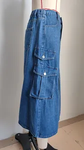 Detailed side view of a denim cargo midi skirt featuring elastic waist and flap pockets