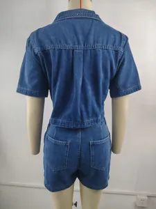 Rear view detail of washed blue denim shirt and shorts set showing back pockets and seams