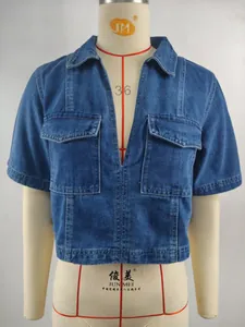 Detailed macro view of a blue V-neck short sleeve denim cropped top with front pockets.