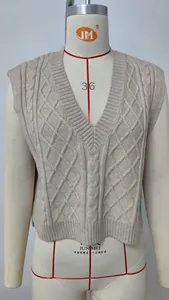A stylish beige cable-knit V-neck sweater vest for women shown on a professional mannequin torso