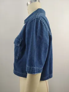 Side view of a short-sleeved loose washed blue denim jacket on a mannequin