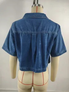 Back view detail of washed blue denim short-sleeved jacket showing pleat detail