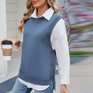 Detailed view of women's blue knit vest featuring side buttons and stylish slit