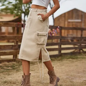 Detail view of khaki cargo midi skirt with side pocket and stylish split hem detail.