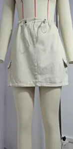 Close-up view of a high-waisted drawstring denim cargo mini skirt with side pockets.