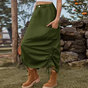 Detail view of army green cargo midi skirt with drawstring ruched side and pockets.