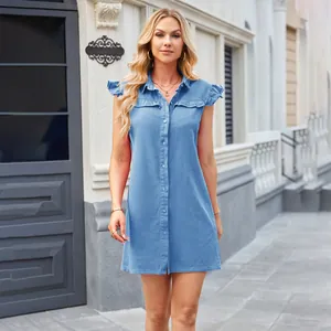 Full body model shot of a blue washed denim shirt dress with ruffle cap sleeves