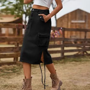 Detailed view of a black denim cargo midi skirt featuring functional pockets and lace-up straps.