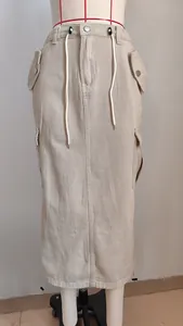 Front view detail of a khaki drawstring denim cargo maxi skirt displayed on a mannequin