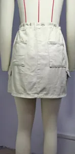 Detailed back view of a beige denim cargo mini skirt with functional pockets