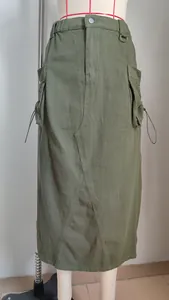 Detailed front view of an olive green retro denim cargo midi skirt on a dress form mannequin