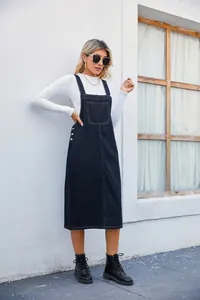Stylish black denim overall midi dress featuring a front pocket and chic side buttons