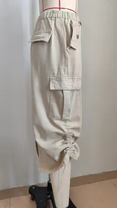 Side detail view of casual khaki cotton cargo midi skirt with drawstring ruched hem