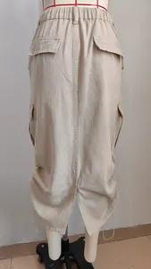 Detailed back view of a khaki drawstring cargo midi skirt displayed on a white mannequin torso