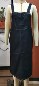 Detailed front view of navy blue denim pinafore midi dress with white stitching on mannequin